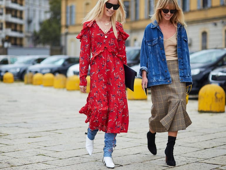 Two girls wearing risky style clothes