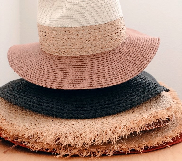 different hats stacked on top of each other 