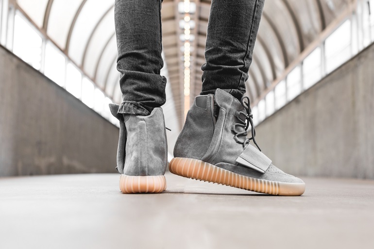 person wearing the adidas yeezy 750 in an indoor object