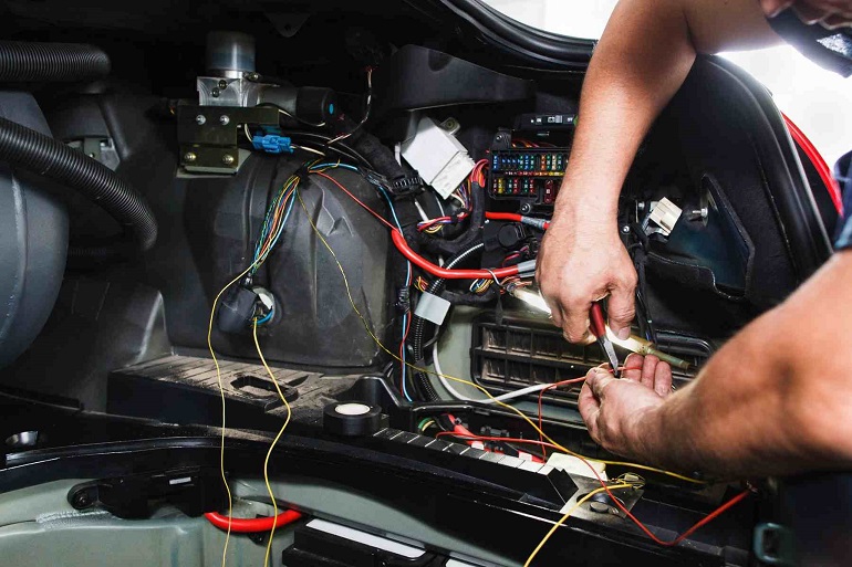 Person working on Automotive Wires