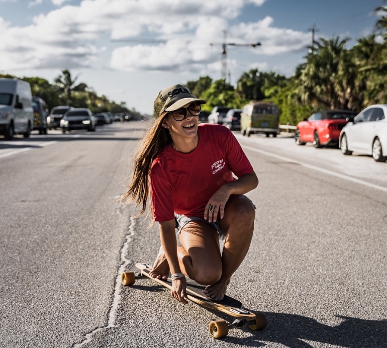 picture of a woman skateboarding on the street