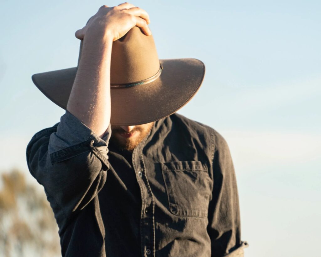 Let's start from the top. When it comes to country-western style, there are many types of headwear to accessorise the look. You can wrap a bandana around your forehead or put on a trucker hat, but the coolest headgear, without any doubt, is a cowboy hat.