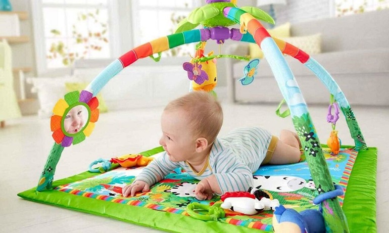 close up of baby play in play mat