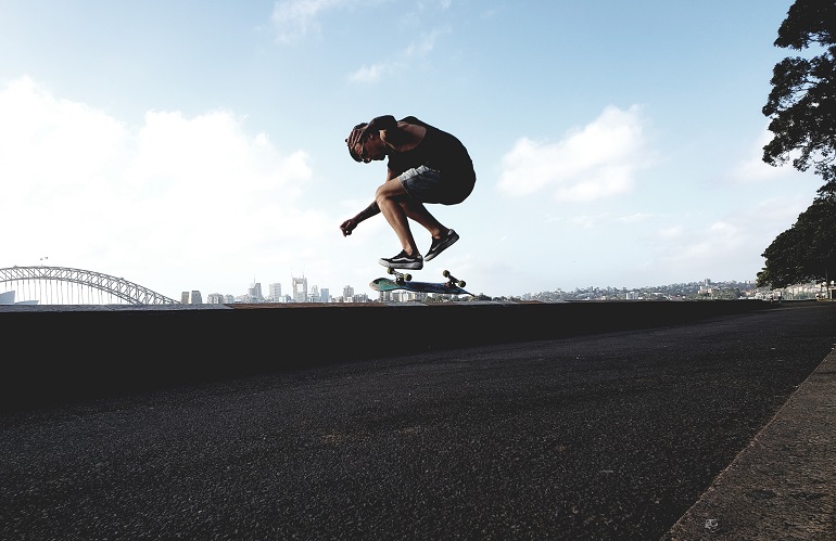 Guy doing a trick on skateboard
