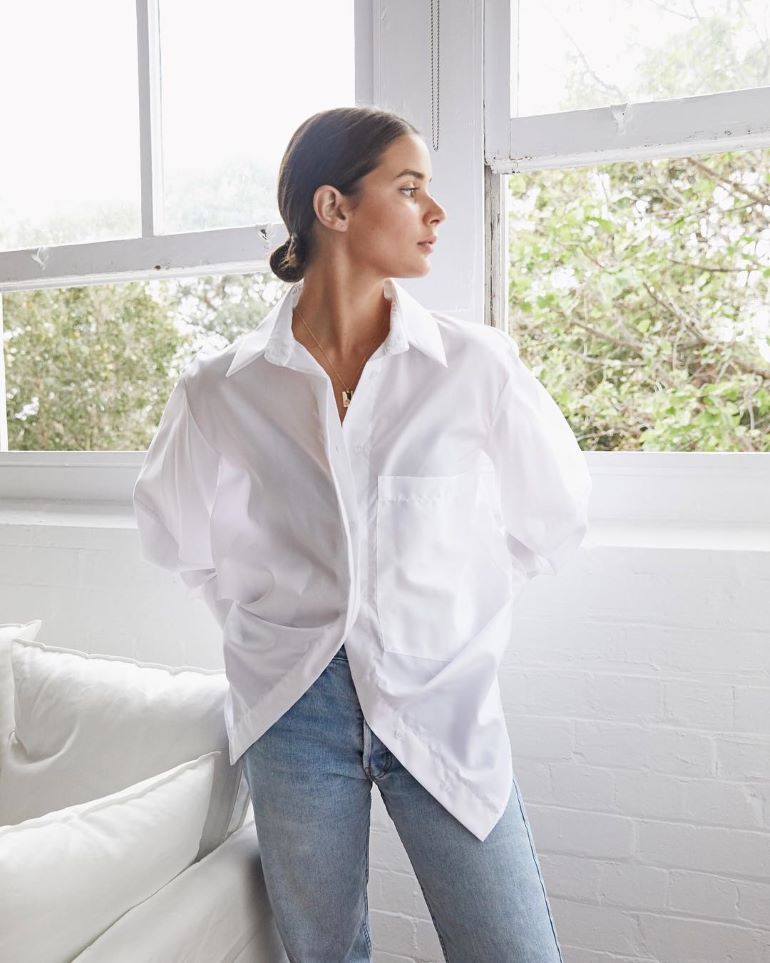 women wearing classic white button down shirt and jeans